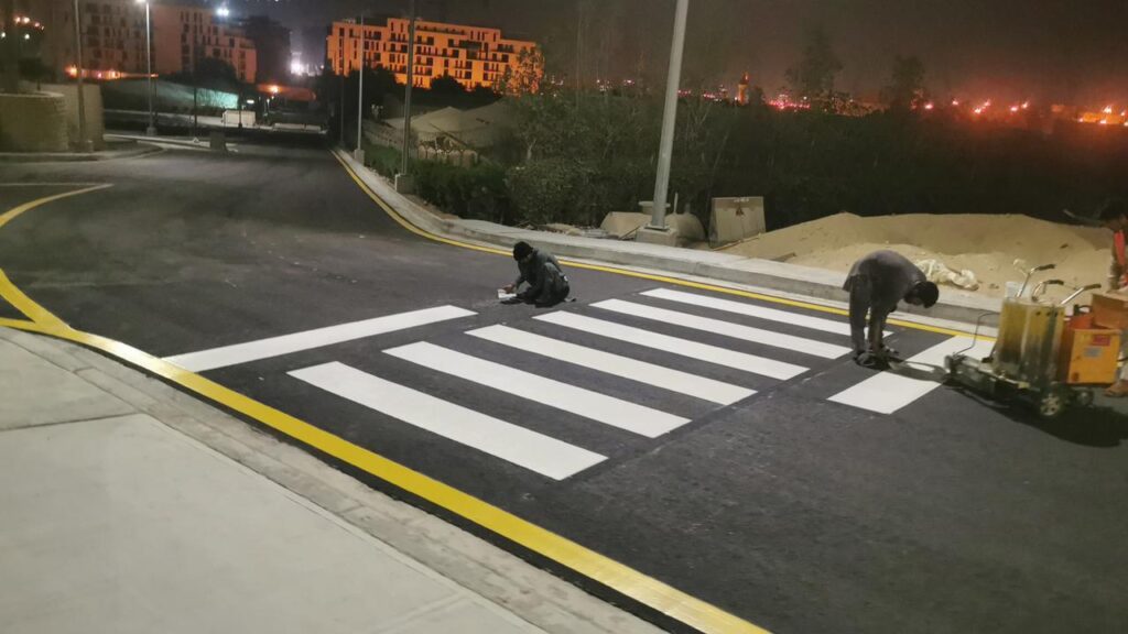 "A picture showing labor working on road marking"